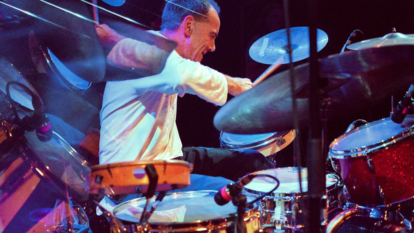 An abstract photo of a man playing a drumkit