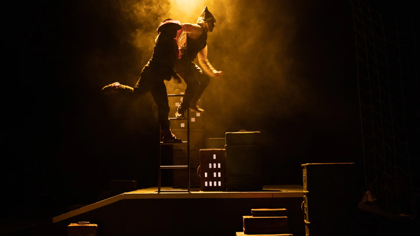 Two figures jumping in the air