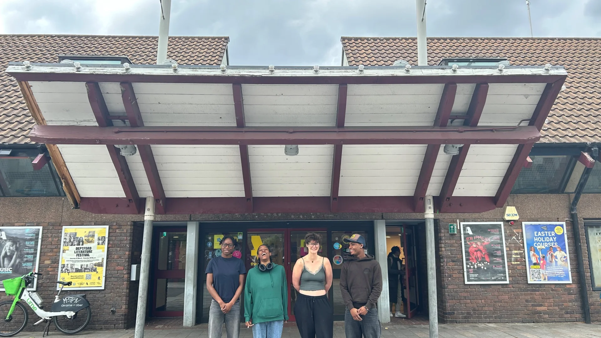 A group of people standing outside the Albany