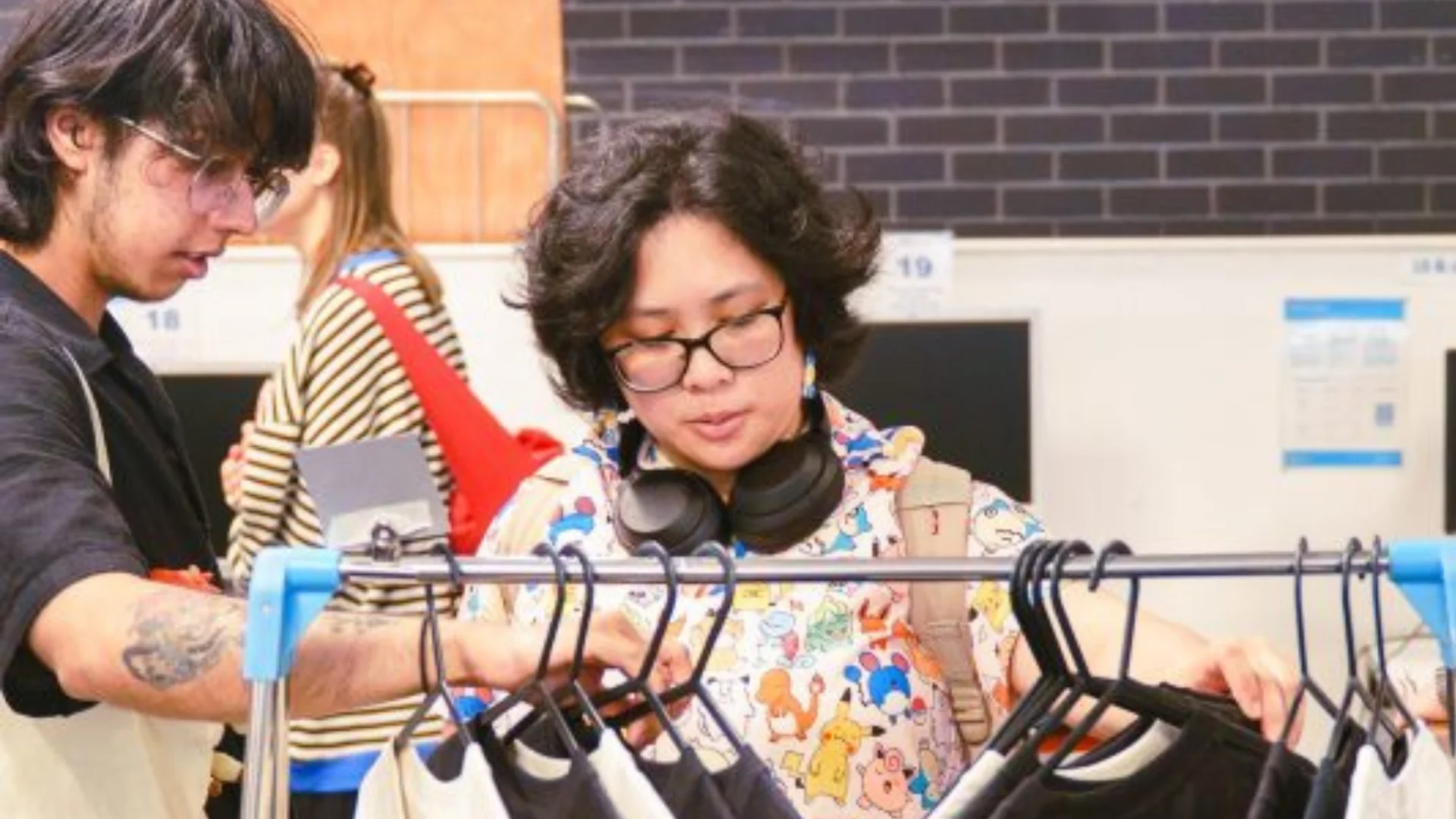 Two people looking at clothes