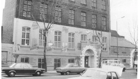 A black and white photo of the Albany Empire building taken in the 1970s.