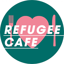 A logo with a pink heart and knife and fork inside a green circle. White text reads 'Refugee Cafe'.